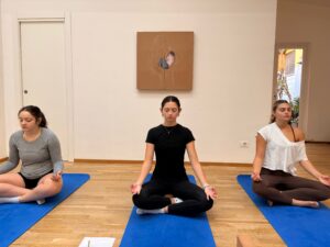 college students participate in a local yoga class while studying abroad in florence