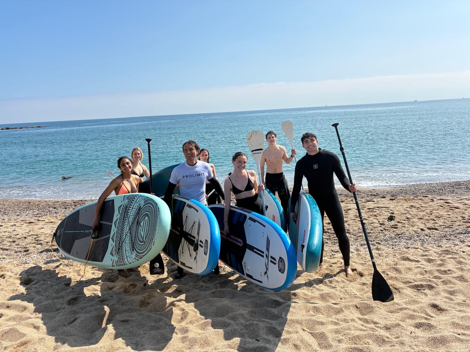 students off for a SUP experience in Barcelona